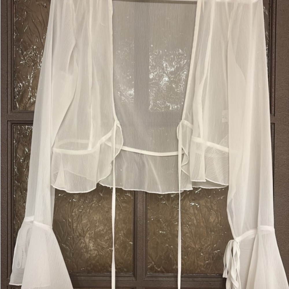 Stradivarius Sheer White Swim cover.